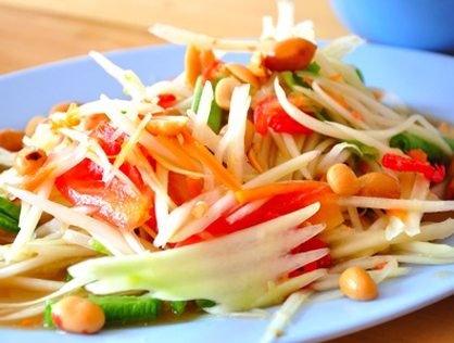 Thai papaya salad with peanuts and tomato
